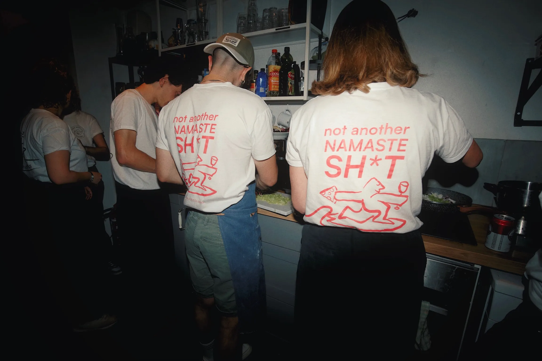 Two people wearing “Pasta. Sleep. Surf. Repeat.” Casa Basilico shirts